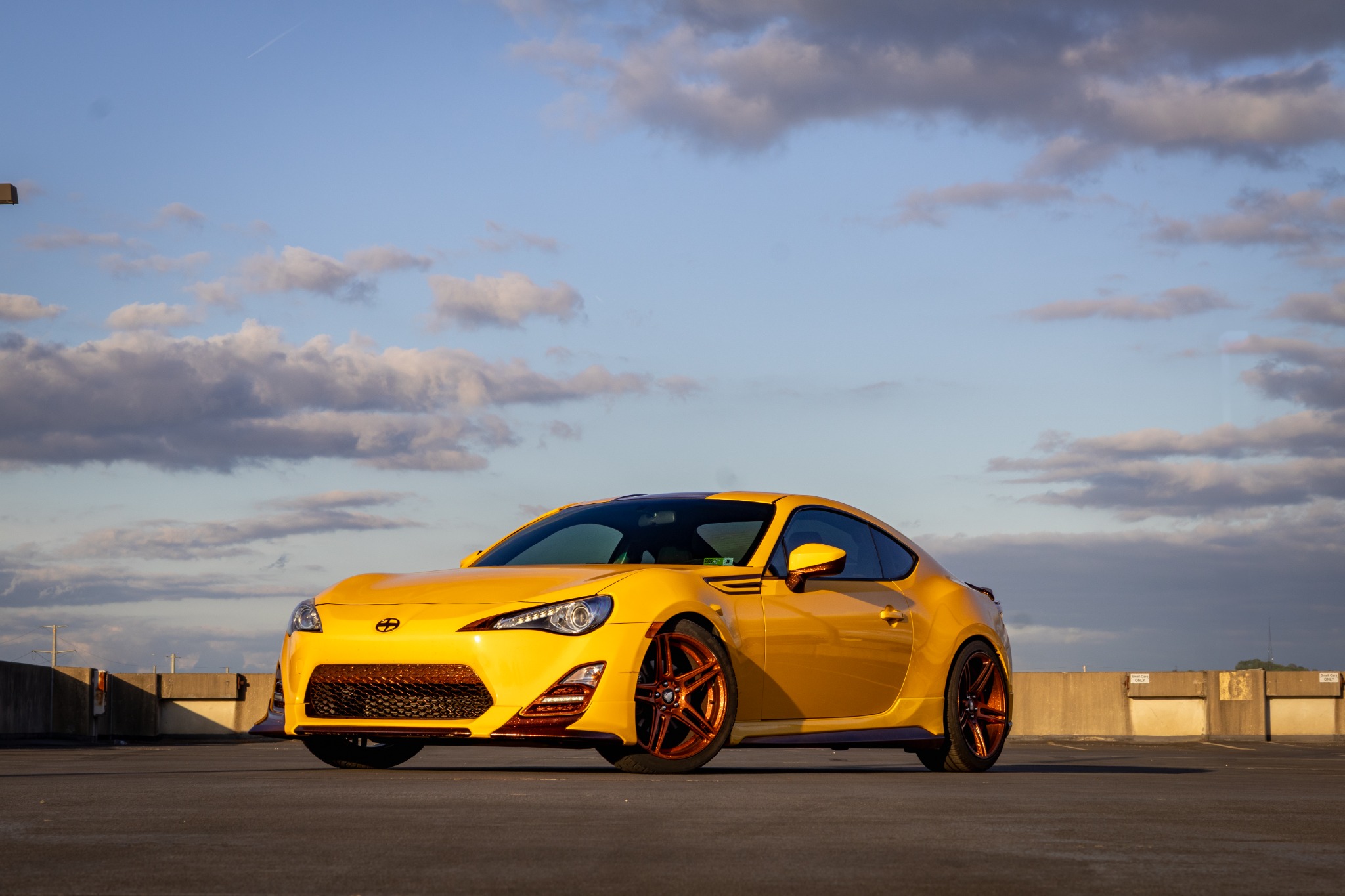 Yellow Scion FR-S on a rooftop