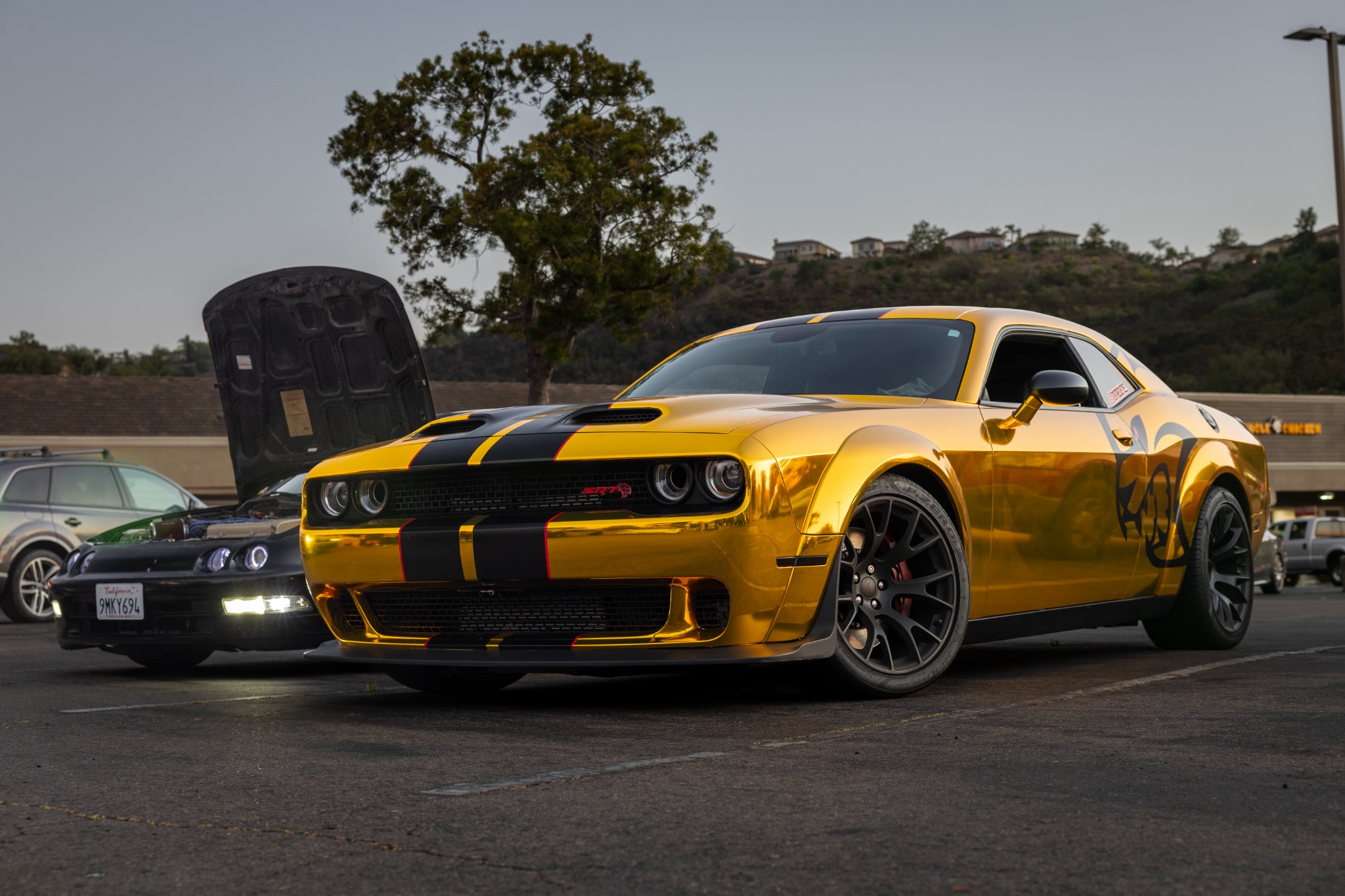 Gold Dodge Challenger photographed at golden hour
